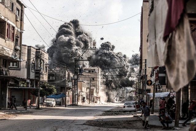 Smoke and dust rise from the area after the Israeli army attack a building in the Nuseirat Refugee Camp in Deir al-Balah, Gaza on July 21, 2024. (Photo by Ali Jadallah/Anadolu via Getty Images)