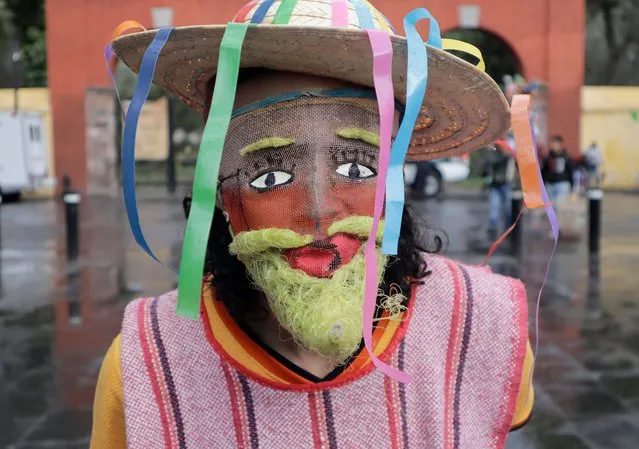 Inhabitant of Xochimilco poses dressed as a chinelo during the Xochimilco Carnival 2022 in Mexico City on March 18, 2022, during the return to green epidemiological traffic light in the capital. (Photo by Gerardo Vieyra/NurPhoto via Getty Images)
