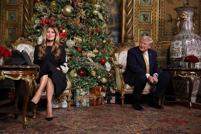 U.S. President Donald Trump and first lady Melania Trump participate in NORAD Santa tracker phone calls, on Christmas Eve, from the Mar-a-lago club in Palm Beach, Florida, U.S., December 24, 2025. (Photo by Jessica Koscielniak/Reuters)