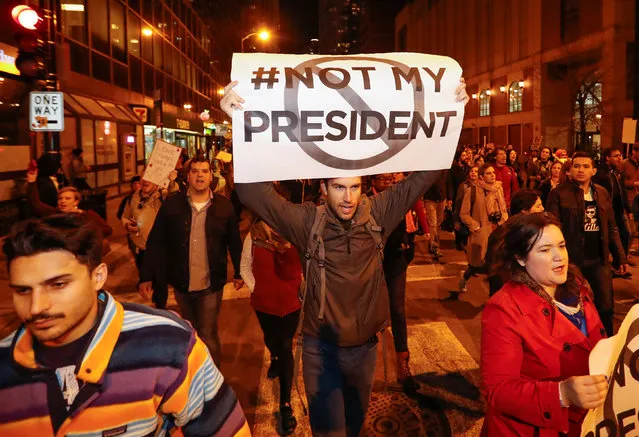 Protesters walk during a protest against Republican president-elect Donald Trump in Chicago, Illinois, U.S. November 9, 2016. (Photo by Kamil Krzacznski/Reuters)