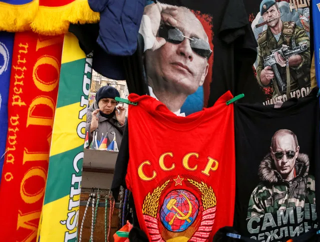 T-shirts depicting images of Russia's President Vladimir Putin and former USSR coat of arms are on sale at the street in central Chisinau, Moldova, November 12, 2016. (Photo by Gleb Garanich/Reuters)