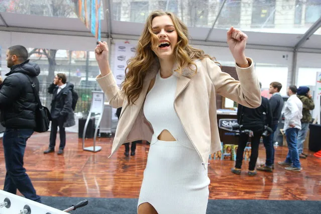 Sports Illustrated swimsuit model Solveig celebrates after scoring while playing foosball before the start of SwimCity festival in New York City on Monday February 9, 2015. (Photo by Gordon Donovan/Yahoo News)