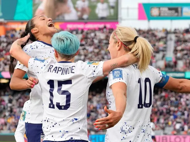 United States' Lindsey Horan, right, celebrates with Sophia Smith, left, and Megan Rapinoe after scoring during the Women's World Cup soccer match between the United States and Vietnam at Eden Park in Auckland, New Zealand, Saturday, July 22, 2023. (Photo by Abbie Parr/AP Photo)