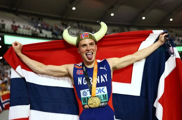 Karsten Warholm of Team Norway celebrates wearing a viking hat winning the Men's 400m Hurdles Final during day five of the World Athletics Championships Budapest 2023 at National Athletics Centre on August 23, 2023 in Budapest, Hungary. (Photo by Kai Pfaffenbach/Reuters)