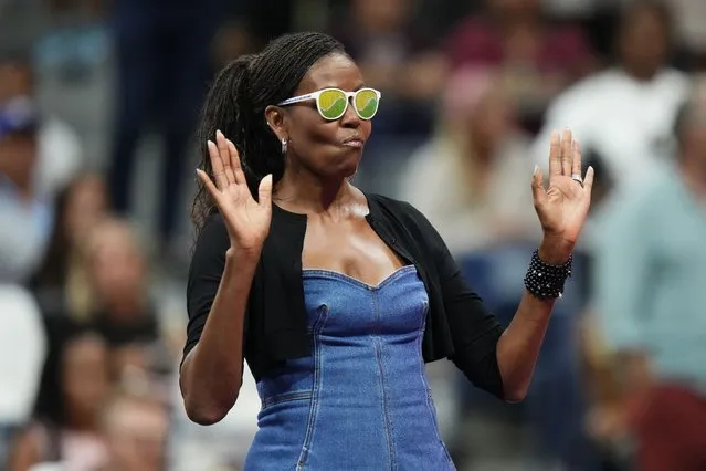 Former first lady Michelle Obama gestures during the opening ceremony of the of the U.S. Open tennis championships, Monday, August 28, 2023, in New York. (Photo by Frank Franklin II/AP Photo)