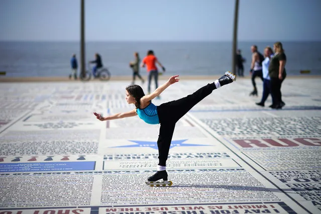 A young girl practices her skating skills in the Spring sunshine on Blackpool promenade as parts of the UK are set to see the warmest day of the year so far on March 30, 2021 in Blackpool, United Kingdom.  Forecasters are predicting temperatures of 22C (72F) and with the easing of pandemic lockdown rules many people will be heading for the outdoors. (Photo by Christopher Furlong/Getty Images)