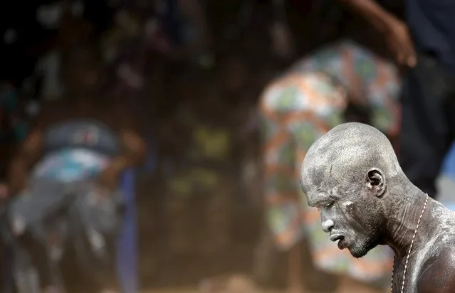 A devotee attends the annual voodoo festival in Ouidah in Benin, January 10, 2016. (Photo by Akintunde Akinleye/Reuters)