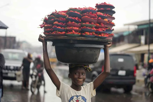 A young girl sells peppers on the street in Lagos, Nigeria on Saturday, September 16, 2023. (Phoot by Sunday Alamba/AP Photo)