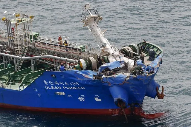 This photo shows a chemical tanker, Ulsan Pioneer after a collision on the coast of Imabari, Ehime prefecture, southern Japan Friday, May 28, 2021. A freighter sank in a Japanese strait early Friday after colliding with the chemical tanker operated by a South Korean company, and three crew members from the cargo ship are missing. (Photo by Suo Takekuma/Kyodo News via AP Photo)