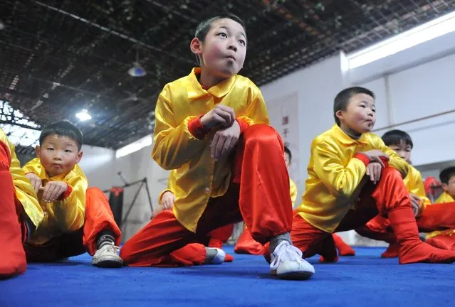 Students practice martial arts named Houquan, or “Monkey boxing” in English, ahead of the upcoming Chinese Lunar New Year, at a martial arts training centre, in Linan, Zhejiang province, January 31, 2016. (Photo by Reuters/China Daily)