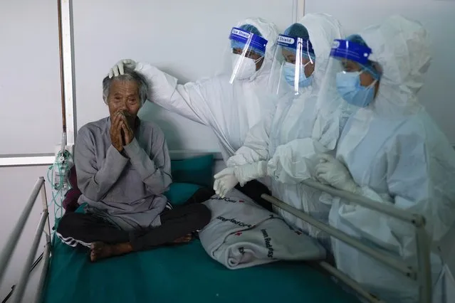 Frontline health workers bid farewell to visually impaired 74 years old Kaile Tamang after recovering from COVID-19 at Radha Soami COVID Isolation & Oxygen Therapy Center in Kathmandu, Nepal on Friday, June 25, 2021. (Photo by Skanda Gautam/ZUMA Wire/Rex Features/Shutterstock)