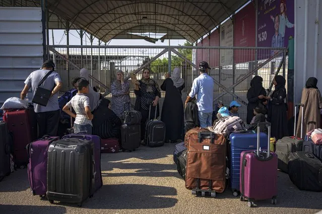 Palestinians wait to cross into Egypt at Rafah, Gaza Strip, on Wednesday, November 1, 2023. (Photo by Fatima Shbair/AP Photo)