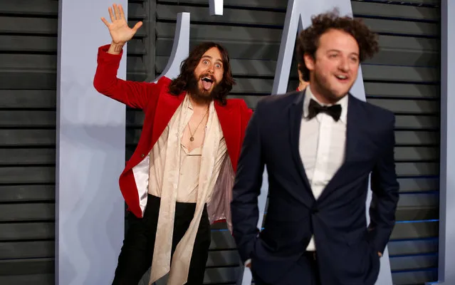 Actor Jared Leto (L) jokes around with a friend outside the Vanity Fair Oscar Party in Beverly Hills, March 3, 2018. (Photo by Danny Moloshok/Reuters)