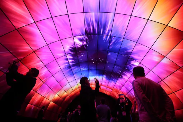 Attendees view video on a tunnel of LG OLED televisions during the 2017 CES in Las Vegas, Nevada, U.S., January 5, 2017. (Photo by Steve Marcus/Reuters)