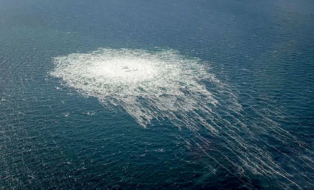 This handout picture released on September 27, 2022 by the Danish Defence Command shows the gas leak at the Nord Stream 2 gas pipeline as it is seen from the Danish Defence's F-16 rejection response off the Danish Baltic island of Bornholm, south of Dueodde. The two Nord Stream gas pipelines linking Russia and Europe have been hit by unexplained leaks, Scandinavian authorities said on September 27, 2022, raising suspicions of sabotage. The pipelines have been at the centre of geopolitical tensions in recent months as Russia cut gas supplies to Europe in suspected retaliation against Western sanctions following its invasion of Ukraine. (Photo by Handout/Danish Defence via AFP Photo)