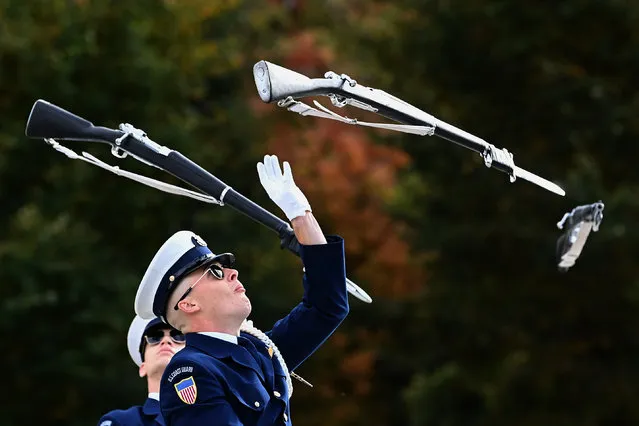 Coasties, part of the U.S. Coast Guard Drill Team perform during the Joint Services Drill-Off on the National Mall October 19, 2022 in Washington, DC. The Marines took the top prize in the Joint Services Drill competition that also included the U.S. Air Force, Army, Navy and Coast Guard. (Photo by Katherine Frey/The Washington Post)