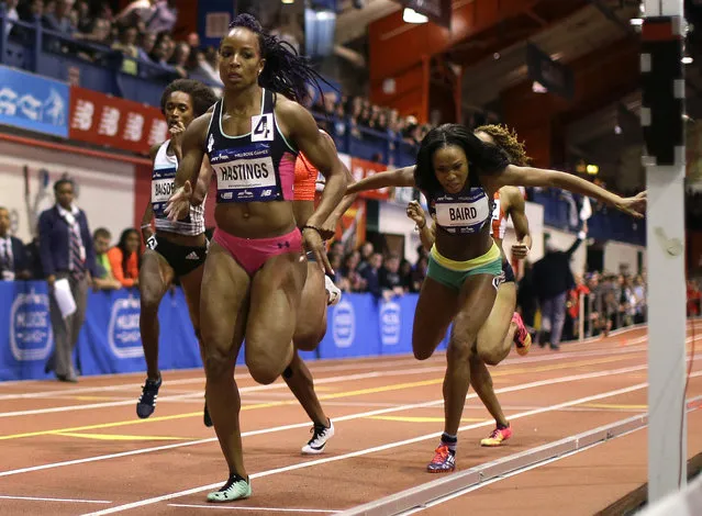 Natasha Hastings (4) leads the pack going into the last lap of the women's 400 meter run at the Millrose Games, Saturday, February 20, 2016, in New York. Hastings won the event. (Photo by Julie Jacobson/AP Photo)
