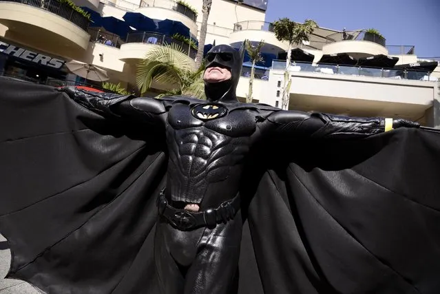 A fan poses dressed as a DC Comics Super Hero at the DC Comics Super Hero World Record Event to set a Guinness World Record at the Hollywood & Highland Center on Saturday, April 18, 2015, in Los Angeles. (Photo by Dan Steinberg/Invision for Warner Bros. Consumer Products/AP Images)