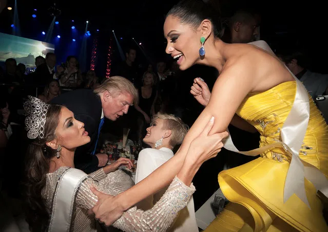 Billionaire and then Miss Universe co-owner Donald Trump, Miss Switzerland Dominique Rinderknecht, Miss Universe 2013 Gabriela Isler and Miss Puerto Rico Monic Perez attend the Miss Universe 2013 pageant after-party at the Crocus City Hall in Moscow, Russia November 10, 2013. (Photo by Stoyan Vassev/Reuters)