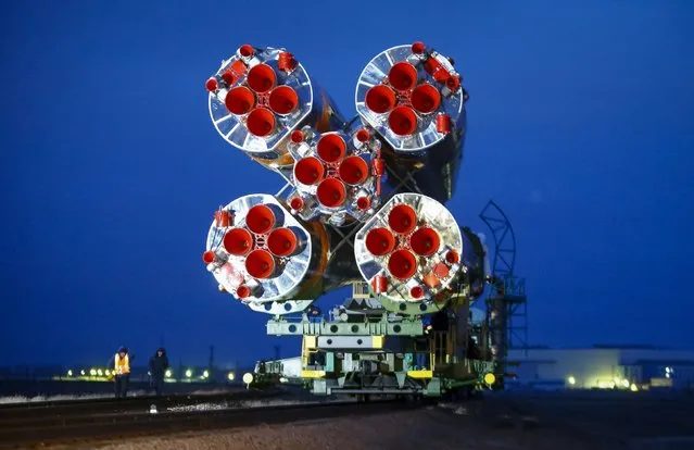 The Soyuz TMA-20M for the next International Space Station (ISS) crew is transported from an assembling hangar to the launchpad ahead of its launch scheduled on March 19, at the Baikonur cosmodrome in Kazakhstan March 16, 2016. A Russian Soyuz rocket has reached its last stop before liftoff Friday with two Russian cosmonauts and veteran NASA flight engineer Jeff Williams, who is slated to break the record for the most cumulative time spent in space by a U.S. astronaut. (Photo by Shamil Zhumatov/Reuters)