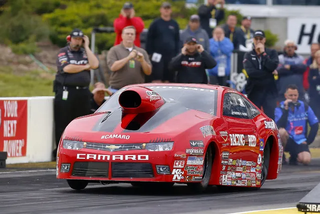 Erica Enders takes off from the starting line during her second run in Pro Stock on Friday May 22, 2015, during the NHRA Kansas Nationals drag races at Heartland Park in Topeka, Kan. Enders took the top qualifying spot while breaking track records in both time, 6.515 seconds, and speed, 211.43 mph. (Photo by Chris Neal/The Topeka Capital-Journal via AP Photo)