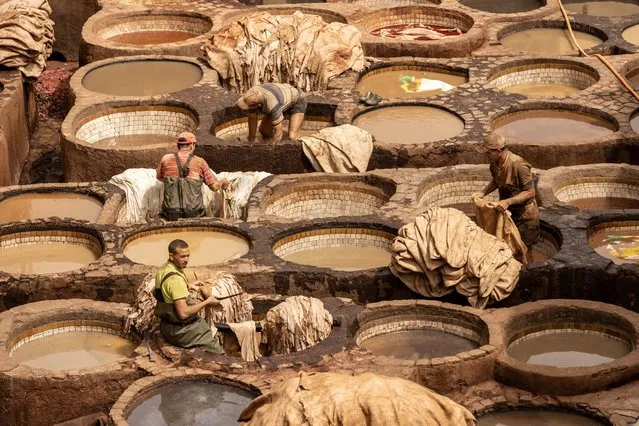 Circular shaped large stone wells are seen on a large area where the coloring process of the leathers take place at the Shuvwara Tannery in Fez, Morocco on April 17, 2024. Shuvwara Tannery is considered to be the oldest tannery on the Arab geography and has been operating since the 11th century. The colored leathers are produced with natural methods for hundreds of years and still continue to be a source of livelihood for thousands of Moroccan citizens. (Photo by Nurettin Boydak/Anadolu via Getty Images)