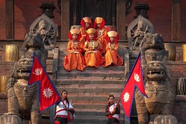 GIrls dressed as living goddess Kumari participate in a traditional Newari community music festival in Bhaktapur, Nepal, Monday, April 8, 2024 The festival was organized by the Shree Nasa Heima Baja Khala group with the aim to highlight the rich heritage of local Newari traditional dance and music. (AP Photo/Niranjan Shrestha)