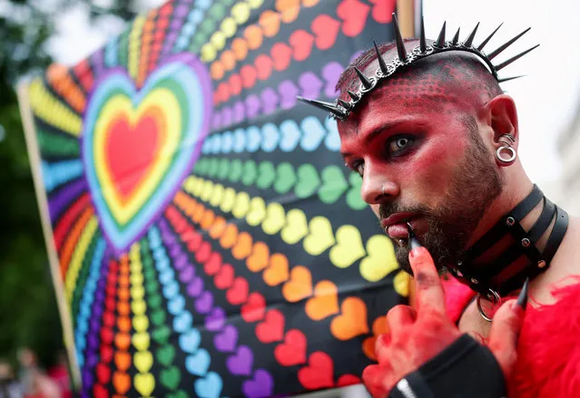 A reveller takes part in the LGBT Rainbow Parade during the EuroPride in Vienna, Austria June 15, 2019. (Photo by Lisi Niesner/Reuters)