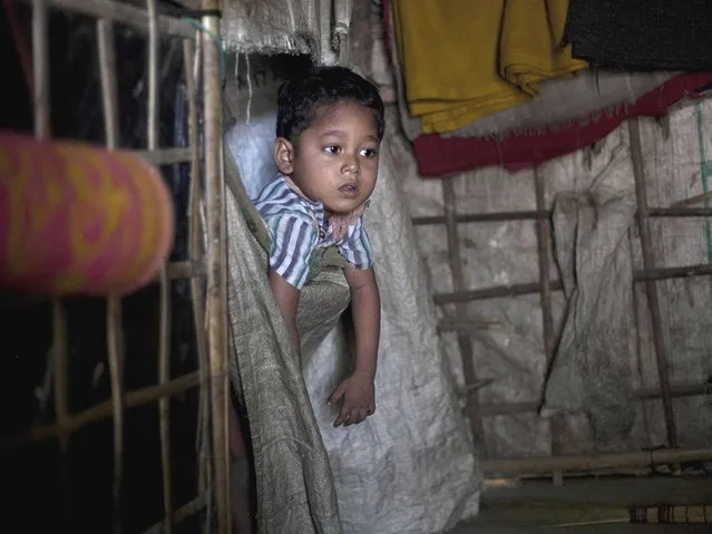 A Rohingya child is seen in a home in the Shamalapur Rohingya refugee settlement in Chittagong district. Tomas Ojea Quintana, the UN special rapporteur on Human Rights, said that recent developments in Myanmar's Rakhine state were the latest in a 'long history of discrimination and persecution against the Rohingya Muslim community which could amount to crimes against humanity', and that the Myanmar government's decision not to allow Rohingya Muslims to register their ethnicity in the March census meant that the population tally was not in accordance with international standards. (Photo by Getty Images/Stringer)