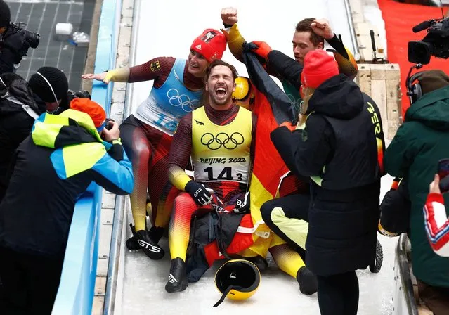 Natalie Geisenberger of Germany, Johannes Ludwig of Germany, Tobias Wendl of Germany and Tobias Arlt of Germany celebrate their teammates slide winning gold during the Luge Team Relay on day six of the Beijing 2022 Winter Olympics at National Sliding Centre on February 10, 2022 in Yanqing, China. (Photo by Thomas Peter/Reuters)