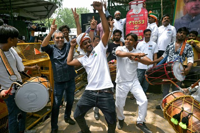 Supporters of Indian National Congress (INC) party celebrate vote counting results for India's general election, near the INC headquarter in New Delhi on June 4, 2024. Vote counting was underway in India's election on June 4, with Prime Minister Narendra Modi all but assured a triumph for his Hindu nationalist agenda that has thrown the opposition into disarray and deepened concerns for minority rights. (Photo by Arun Sankar/AFP Photo)