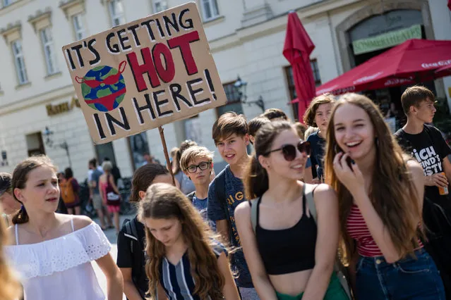 Young people take part in a “Fridays for Future” demonstration against climate change in Leipzig, Germany, 30 August 2019. Students across the world are taking part in a strike movement called #FridayForFuture which takes place every Friday and demands compliance with the goals of the Paris Agreement and the 1.5 degree Celsius reduction target. The movement was sparked by Greta Thunberg of Sweden, a student who started protesting for climate action and the implementation of the Paris Agreement outside the Swedish parliament on every Friday in August 2018. (Photo by Jens Schlueter/EPA/EFE)