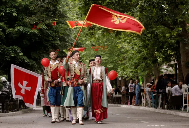 Montenegrins dressed in national costumes wave flags as part of the celebrations for the country's 10th anniversary of its Independence Day in Podgorica, Montenegro, May 21, 2016. (Photo by Stevo Vasiljevic/Reuters)
