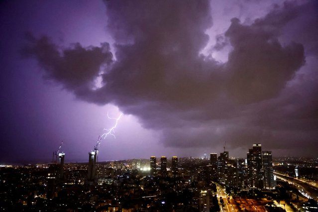 Lightning strikes over the sky in Tel Aviv, Israel, amid the ongoing conflict between Israel and the Palestinian Islamist group Hamas, in Gaza Strip on December 22, 2023. (Photo by Clodagh Kilcoyne/Reuters)