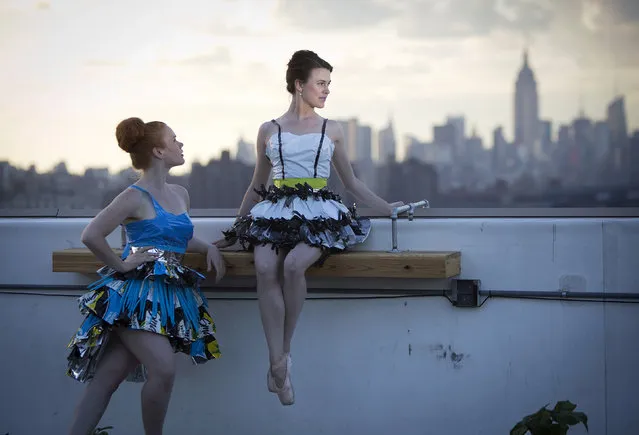 Models take part in the “Trashion” fashion show on the roof of a building in the Brooklyn Navy Yard in the Brooklyn borough of New York May 31, 2014. The show featured designers who used recycled items such as coffee filters, tissue paper, grain sacks and window screens. (Photo by Carlo Allegri/Reuters)