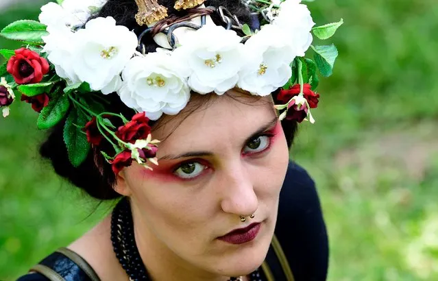 A dressed up woman attends a so-called “Victorian Picnic” during the Wave-Gotik-Treffen (WGT) festival in Leipzig, eastern Germany, on June 2, 2017. (Photo by Tobias Schwarz/AFP Photo)