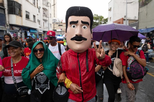 A man wearing a President Nicolas Maduro mask attends a march in support of President Nicolas Maduro, in Caracas, Venezuela, 05 August 2024. The ruling United Socialist Party of Venezuela (PSUV) mobilized hundreds of young people from several regions of the country to march in support of the re-election of Nicolas Maduro, whose victory in the 28 July 28 presidential elections has been questioned inside and outside of the country. (Photo by Ronald Pena R./EPA)