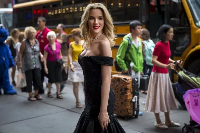 A wax figure of U.S. actress Scarlett Johansson stands outside Madame Tussauds New York attraction shortly after the figure was unveiled in Times Square in New York, July 30, 2015. (Photo by Mike Segar/Reuters)