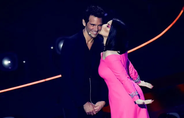 Italian singer Laura Pausini kisses host Mika during the first semi-final of the 2022 Eurovision Song Contest in Turin, Italy, May 10, 2022. (Photo by Yara Nardi/Reuters)