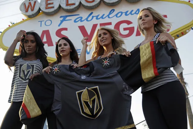Models unveil the Vegas Golden Knights' new hockey jersey Tuesday, June 20, 2017, in Las Vegas. The Knights are an NHL hockey expansion team. (Photo by John Locher/AP Photo)