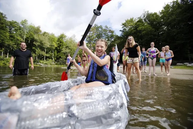 Reid Middle School student Harmony Phillips, 13, successfully sets off in her team's kayak at North Pond in the Savoy Mountain State Forest in Florida, Mass., Wednesday, August 5, 2015. (Photo by Stephanie Zollshan/The Berkshire Eagle via AP Photo)