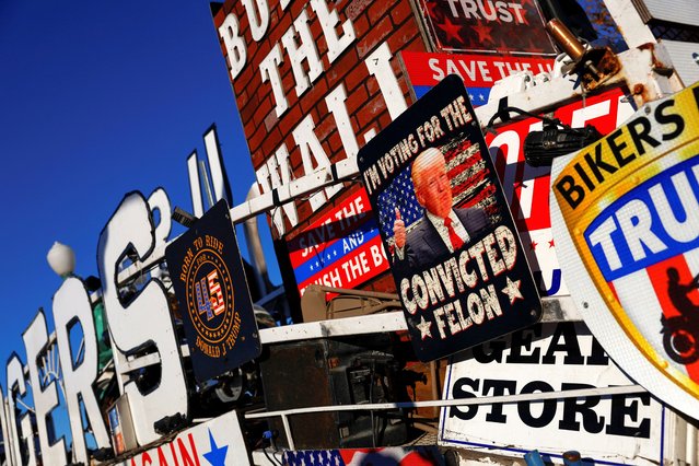 A view shows signs on the day of a campaign event for Republican presidential nominee and former U.S. President Donald Trump, in Novi, Michigan, U.S., October 26, 2024. (Photo by Shannon Stapleton/Reuters)