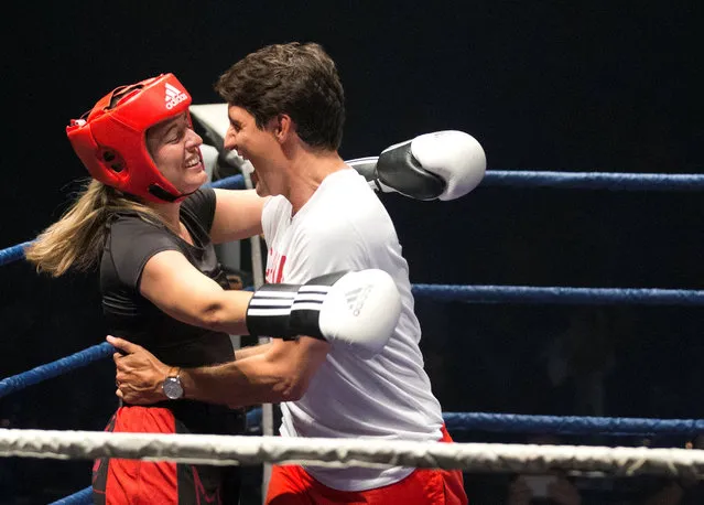 Canada's Prime Minister Justin Trudeau (R) congratulates Canada's Heritage Minister Melanie Joly following her round against boxer Ali Nestor during a charity event in Montreal, Quebec Canada August 23, 2017. (Photo by Christinne Muschi/Reuters)