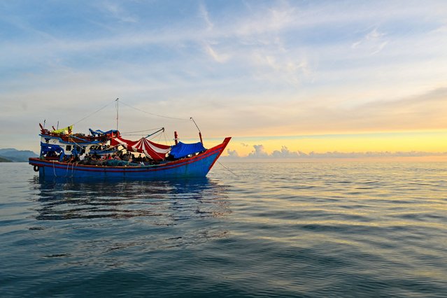 A boat carrying Rohingya refugees, sails ashore off the coast of Labuhan Haji in Southern Aceh province on October 23, 2024. Indonesia will rescue more than 100 Rohingya refugees on October 24 after their boat languished for days off the country's western coast, local officials told AFP. The mostly Muslim ethnic Rohingya are heavily persecuted in Myanmar and thousands risk their lives each year on long and dangerous sea journeys to reach Malaysia or Indonesia's Aceh Province. (Photo by Chaideer Mahyuddin/AFP Photo)