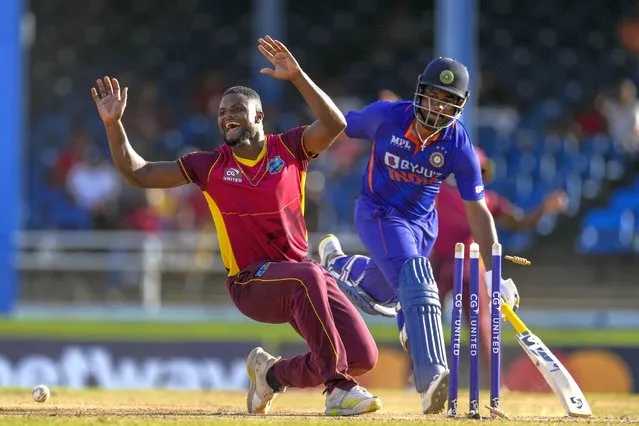 West Indies' Romario Shepherd celebrates dismissing India’s Sanju Samson during the second ODI cricket match at Queen's Park Oval in Port of Spain, Trinidad and Tobago, Sunday, July 24, 2022. (Photo by Ricardo Mazalan/AP Photo)