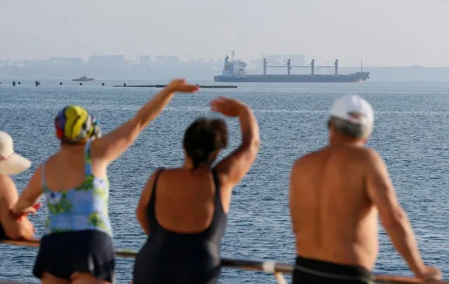 People watch cargo vessel Navi Star carrying 33,000 tonnes of corn to Ireland leave the port of Odesa, Ukraine, 05 August 2022. Two vessels left the port of Chornomorsk and one from the Odesa port. The bulk carriers NAVI STAR, ROJEN, and POLARNET with a total of 57,000 tonnes of corn on board are headed for Turkey, Great Britain, and Ireland as the Administration of Seaports of Ukraine reported. Ukraine started exporting grain since a safe passage deal was signed between Ukraine and Russia on 22 July in Istanbul. Russian troops on 24 February entered Ukrainian territory, starting a conflict that has provoked destruction and a humanitarian crisis. (Photo by EPA/EFE/Rex Features/Shutterstock)