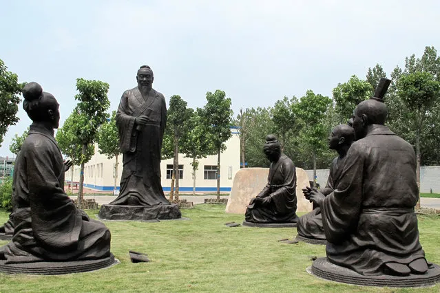 Sculptures of Confucius with his students are seen near the headquarters office building of Chambroad Holding in Boxing, Shandong Province, China, June 27, 2016. (Photo by Aizhu Chen/Reuters)