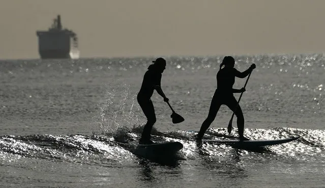 Paddle boarders out on the North Sea at Tynemouth on the North east Coast, England on March 17, 2020. (Photo by Owen Humphreys/PA Images via Getty Images)