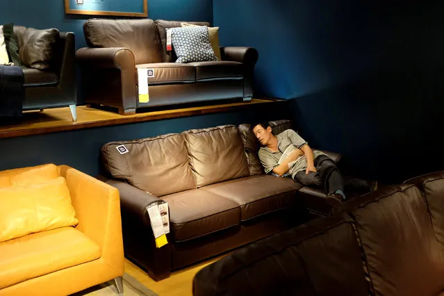 A customer takes a nap at an IKEA store in Beijing, China September 14, 2017. (Photo by Jason Lee/Reuters)