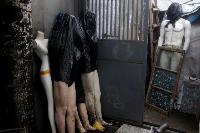 Discarded mannequins stand in a corner in a hutong, or alley, in Beijing, China, July 30, 2016. (Photo by Thomas Peter/Reuters)